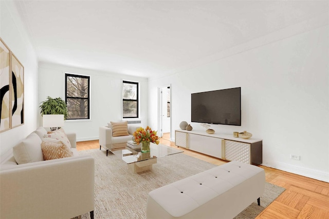 living area featuring baseboards