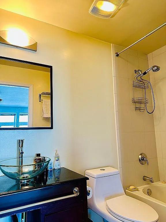 full bath with toilet, shower / bath combination, and vanity