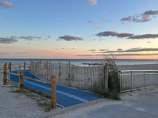 gate with a water view and fence