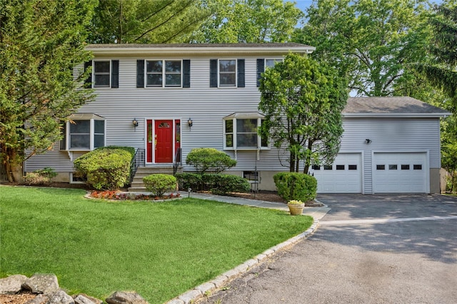 3 Benjamin Ct, Ardsley, NY 10502 - colonial house with asphalt driveway, a front yard, and a garage