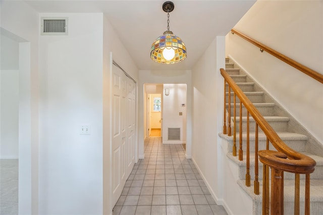 3 Benjamin Ct, Ardsley, NY 10502 - hall with stairs, light tile patterned floors, and baseboards