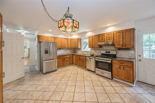 3 Benjamin Ct, Ardsley, NY 10502 - kitchen featuring appliances with stainless steel finishes, a sink, light tile patterned floors, tasteful backsplash, and plenty of natural light