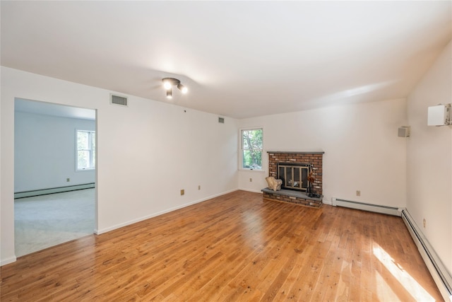 3 Benjamin Ct, Ardsley, NY 10502 - unfurnished living room with a baseboard radiator and light wood-style flooring