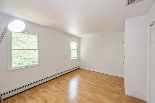 3 Benjamin Ct, Ardsley, NY 10502 - spare room featuring baseboard heating, light wood-style flooring, and baseboards