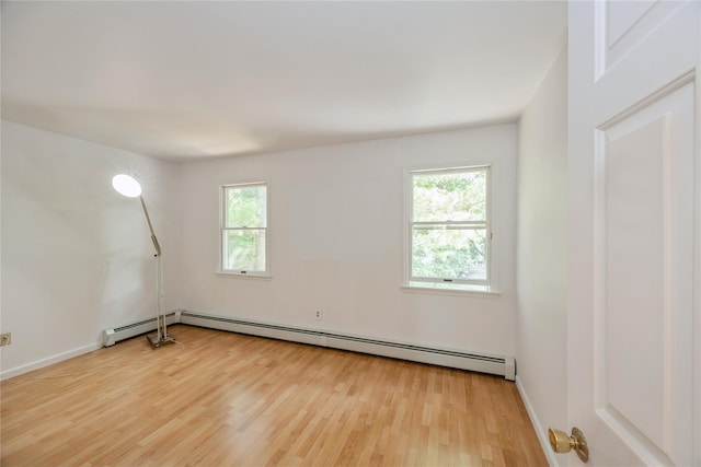 3 Benjamin Ct, Ardsley, NY 10502 - empty room with healthy amount of natural light and light wood-style flooring