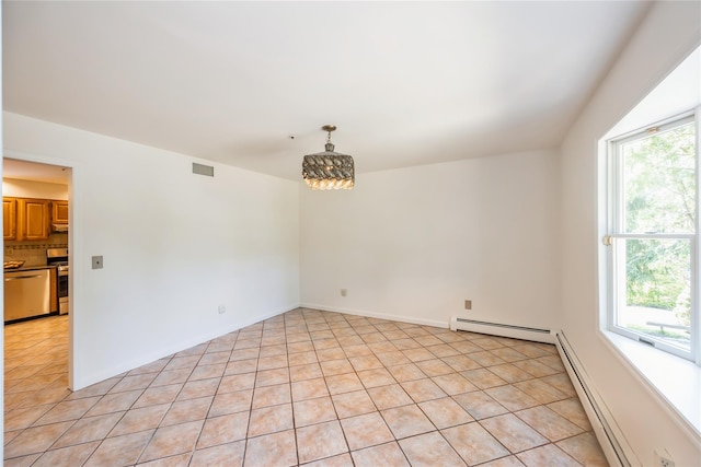 3 Benjamin Ct, Ardsley, NY 10502 - empty room with baseboard heating, light tile patterned floors, and a chandelier