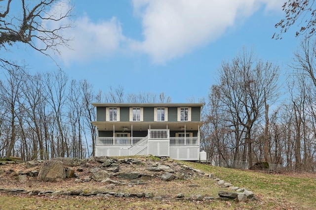 view of front of property with a porch and stairs