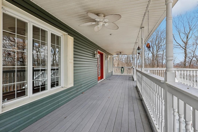 deck featuring a ceiling fan and a porch
