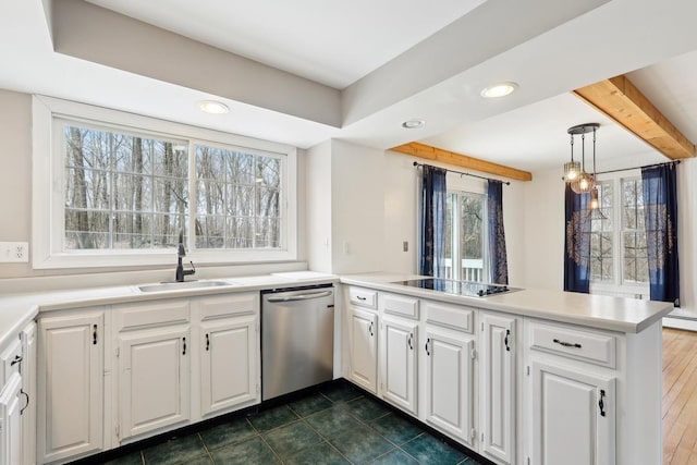 kitchen with a wealth of natural light, a peninsula, black electric stovetop, and dishwasher