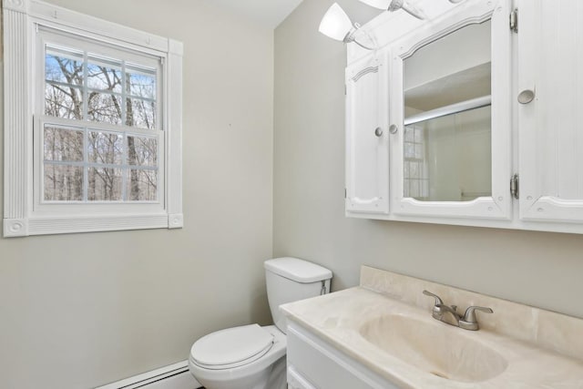 bathroom with vanity, a baseboard radiator, a shower with door, and toilet