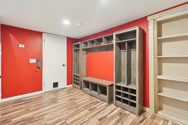mudroom with visible vents, baseboards, and wood finished floors