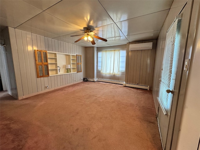 interior space featuring wood walls, an AC wall unit, carpet flooring, built in features, and ceiling fan