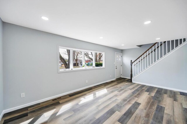 81 New Ave, Wyandanch, NY 11798 - interior space with stairway, wood finished floors, baseboards, visible vents, and recessed lighting