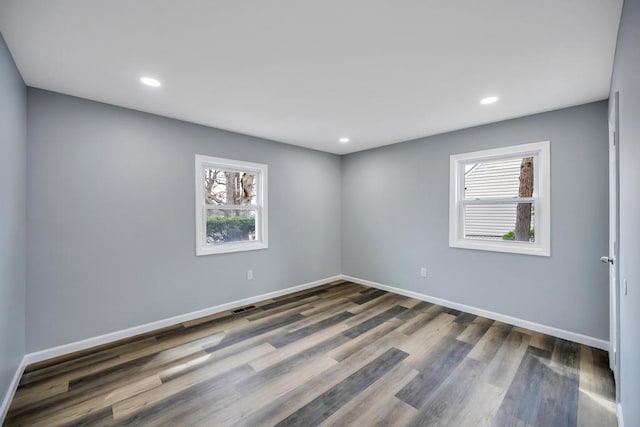 81 New Ave, Wyandanch, NY 11798 - unfurnished room featuring dark wood finished floors, recessed lighting, baseboards, and visible vents