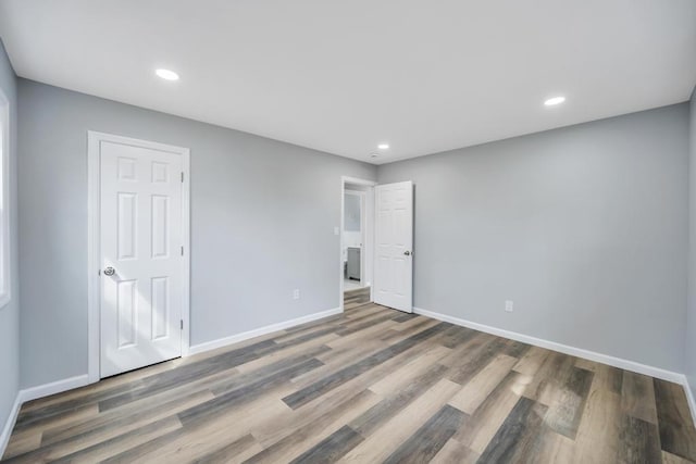 81 New Ave, Wyandanch, NY 11798 - unfurnished bedroom with recessed lighting, baseboards, and wood finished floors
