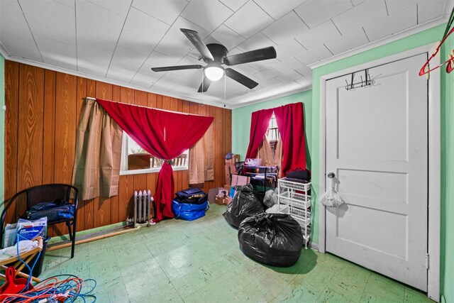 53 Dill Rd, Forestburgh, NY 12777 - playroom featuring a healthy amount of sunlight, wood walls, tile patterned floors, and a ceiling fan