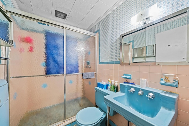 53 Dill Rd, Forestburgh, NY 12777 - bathroom featuring a sink, wallpapered walls, tile walls, and a shower stall