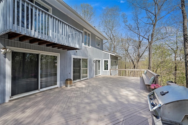 wooden deck featuring area for grilling