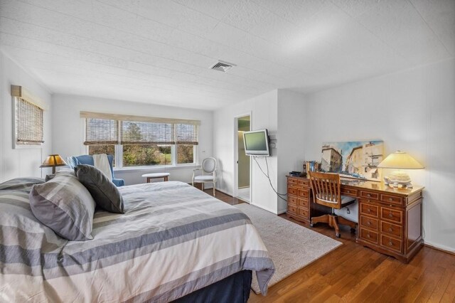 100 S Fairview Ave, Montauk, NY 11954 - bedroom featuring baseboards, visible vents, and wood finished floors