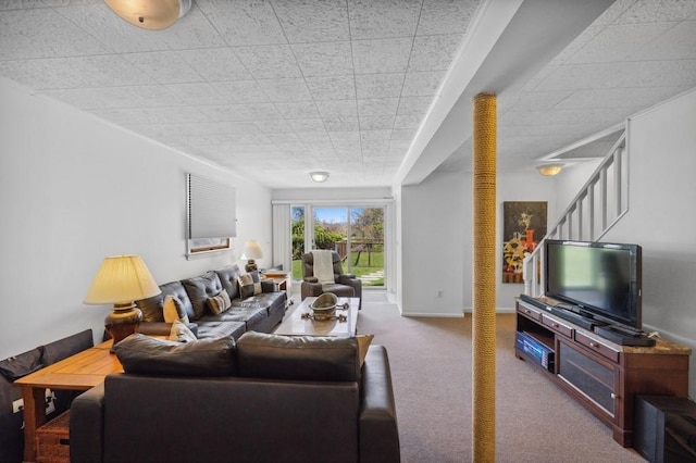 100 S Fairview Ave, Montauk, NY 11954 - living room featuring baseboards, stairway, and carpet