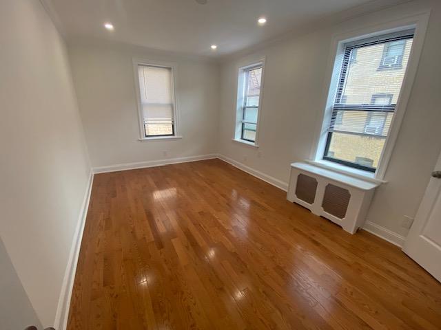 unfurnished room featuring recessed lighting, baseboards, and light wood-style flooring