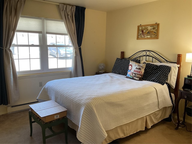 bedroom featuring baseboard heating and carpet floors