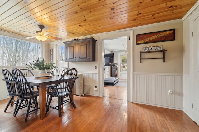 160 Mill St, Wallkill, NY 12589 - dining space with plenty of natural light, crown molding, wainscoting, light wood-style flooring, and ceiling fan