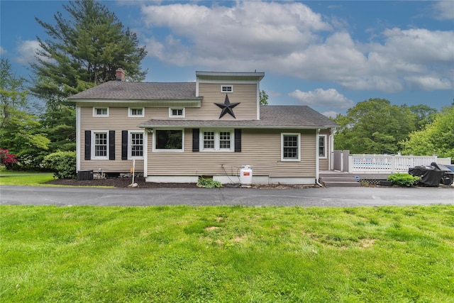 160 Mill St, Wallkill, NY 12589 - rear view of house with a lawn, a chimney, a wooden deck, roof with shingles, and central air condition unit