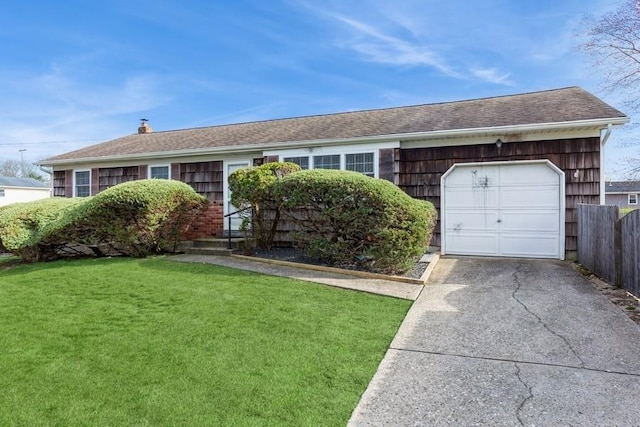 ranch-style home featuring an attached garage, driveway, a front yard, and fence