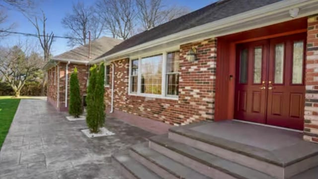 107 Park Ln, West Harrison, NY 10604 - view of exterior entry with brick siding