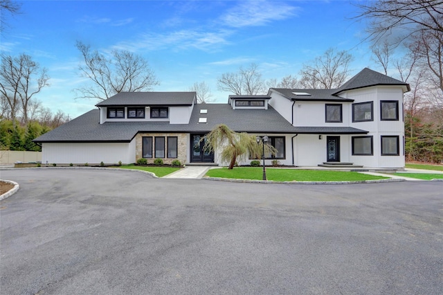 140 Daly Rd, East Northport, NY 11731 - view of front facade featuring a front lawn and fence