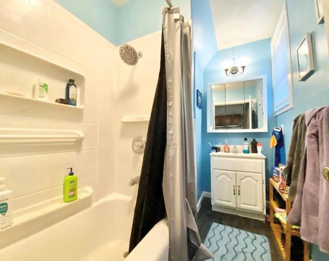 full bath featuring shower / tub combo, vanity, and wood finished floors