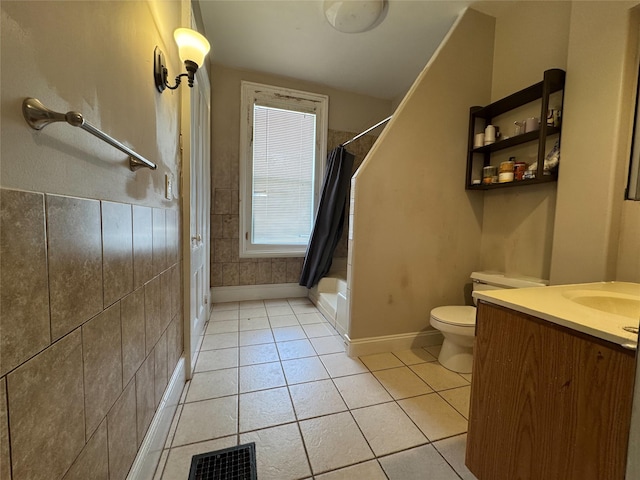bathroom with shower / bath combination with curtain, vanity, visible vents, toilet, and tile patterned floors