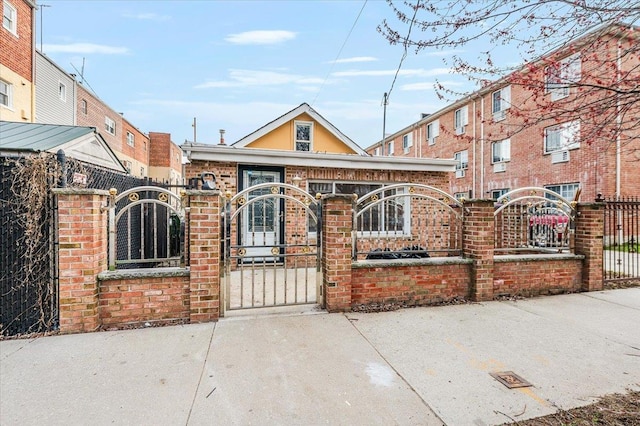 2738 Miles Ave, Bronx, NY 10465 - view of front of property featuring brick siding, a gate, and a fenced front yard