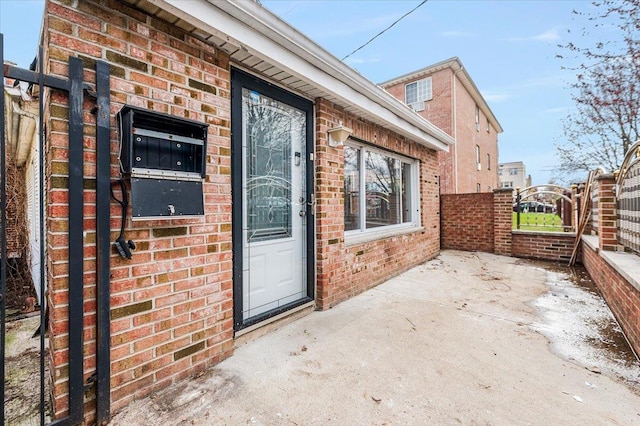 2738 Miles Ave, Bronx, NY 10465 - property entrance featuring brick siding, a gate, and fence