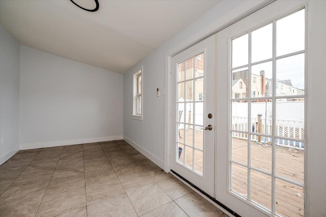 2738 Miles Ave, Bronx, NY 10465 - entryway with light tile patterned flooring, baseboards, vaulted ceiling, and french doors