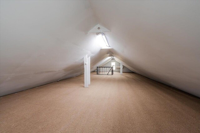 2738 Miles Ave, Bronx, NY 10465 - bonus room featuring carpet flooring and vaulted ceiling