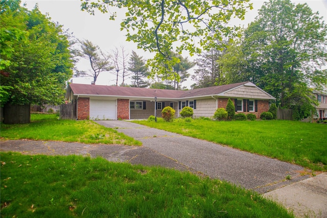 5 Millstream Ln, Stony Brook, NY 11790 - ranch-style home featuring a garage, asphalt driveway, and brick siding