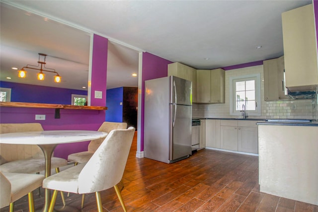 5 Millstream Ln, Stony Brook, NY 11790 - kitchen with freestanding refrigerator, dark wood-style flooring, dishwasher, tasteful backsplash, and dark countertops