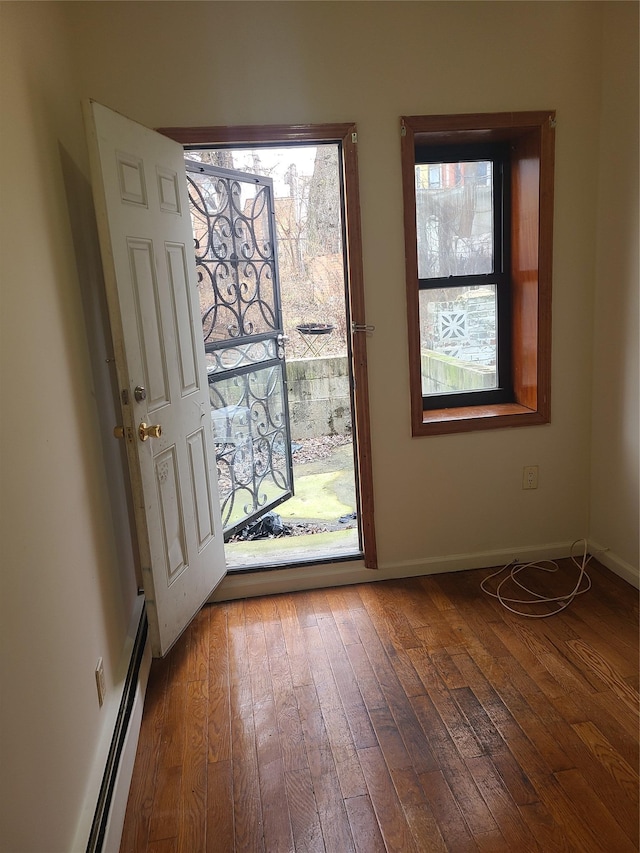 1871 Prospect Pl, Brooklyn, NY 11233 - entryway featuring hardwood / wood-style floors, baseboards, and a baseboard radiator