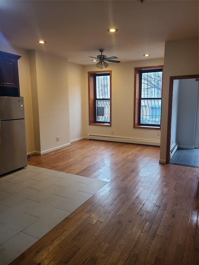 1871 Prospect Pl, Brooklyn, NY 11233 - unfurnished living room with hardwood / wood-style floors, recessed lighting, a ceiling fan, and a baseboard radiator