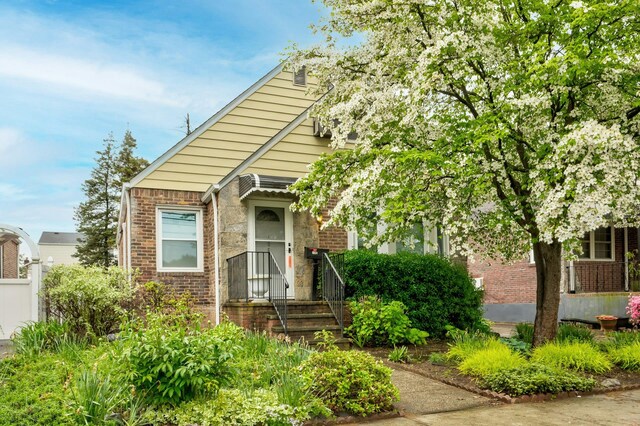view of front of home featuring brick siding