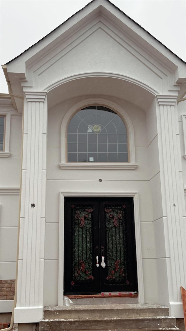 23 Grouse Ln, Levittown, NY 11756 - doorway to property featuring french doors