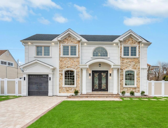 23 Grouse Ln, Levittown, NY 11756 - view of front of property with french doors, stone siding, and a front yard