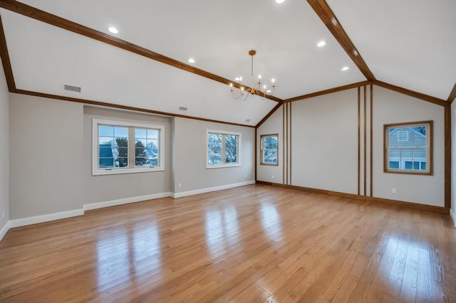 23 Grouse Ln, Levittown, NY 11756 - unfurnished room featuring lofted ceiling with beams, baseboards, a notable chandelier, and light wood-style floors