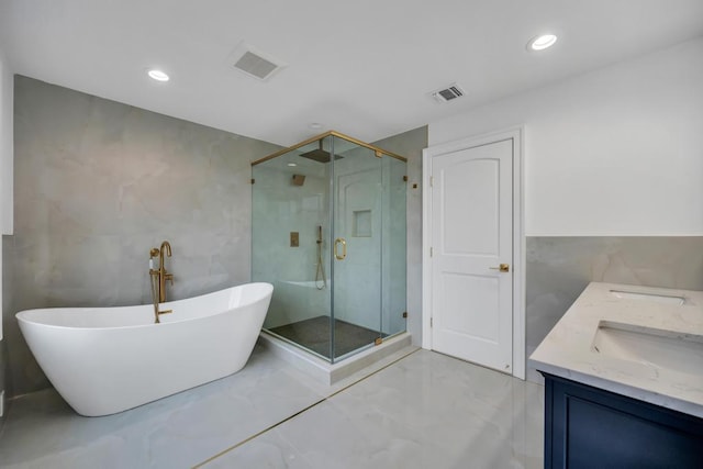 23 Grouse Ln, Levittown, NY 11756 - bathroom featuring a shower stall, tile walls, marble finish floor, a soaking tub, and visible vents