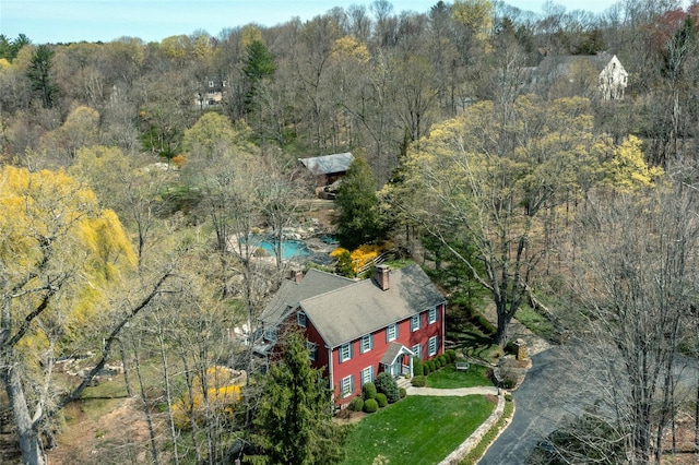 bird's eye view featuring a forest view