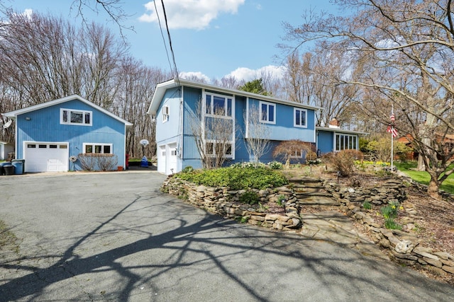 split foyer home with a garage and driveway