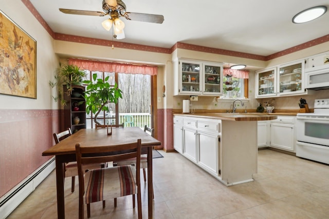 kitchen featuring white cabinets, glass insert cabinets, a baseboard radiator, and white appliances