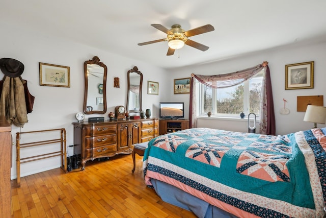bedroom featuring a ceiling fan and hardwood / wood-style flooring
